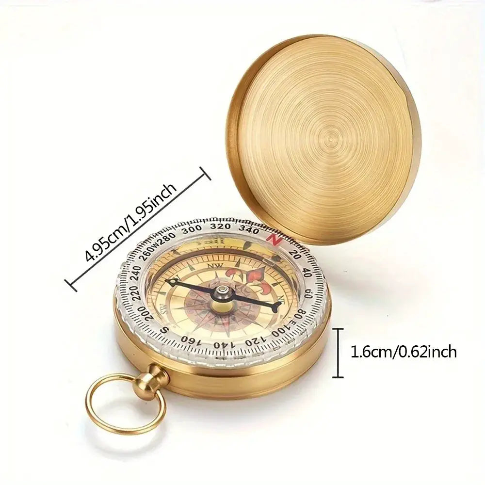 Brass pocket compass by Simples Market for camping and hiking; water-resistant handheld navigation device.