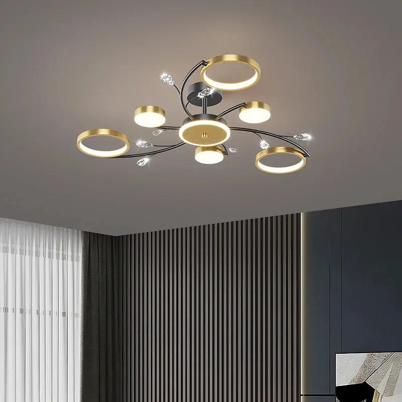 IRALAN modern ceiling chandelier with gold rings, black metal arms and crystal accents for living room