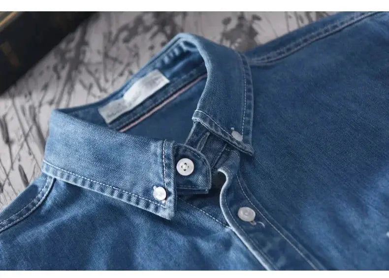 Men's long-sleeved light-blue denim shirt with button-down collar and white buttons, cotton fabric