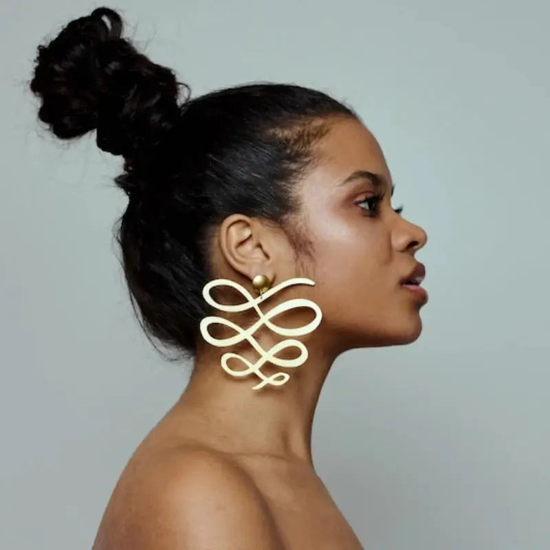 Large gold-tone squiggle dangle earrings with looping design, fashion African jewelry