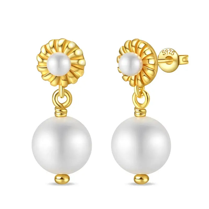 Classic pearl drop earrings with gold-tone floral top and dangling pearl beads by Simples Market