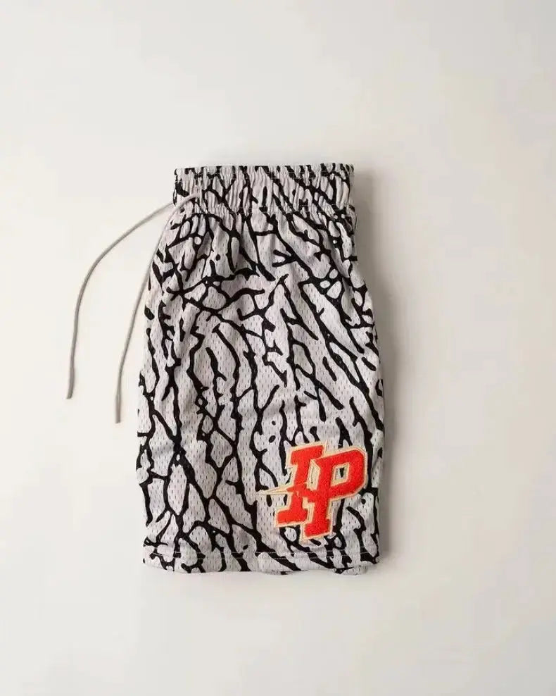 Men's shorts with gray/black cracked pattern and red IP logo