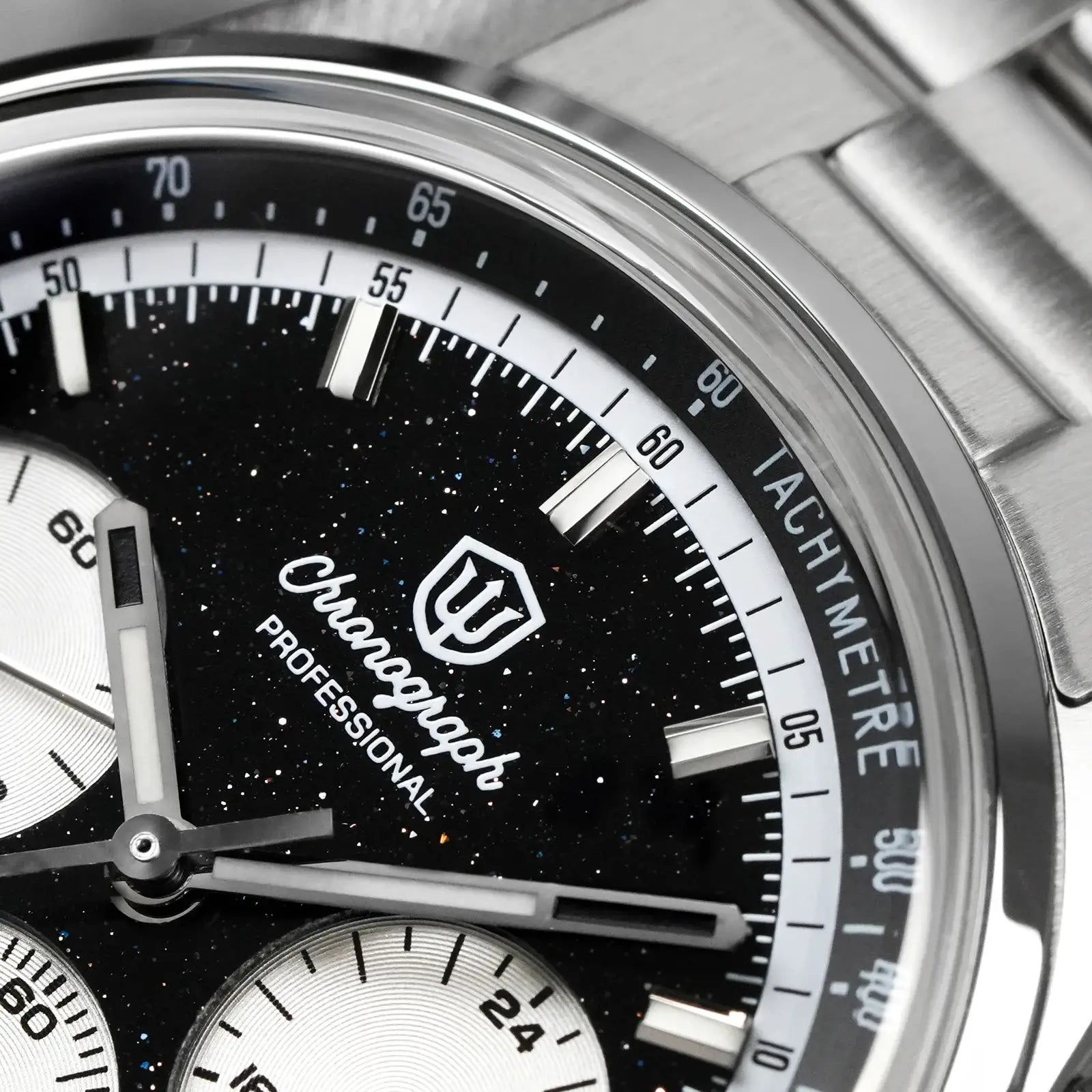 Mecha quartz chronograph watch in stainless steel with black speckled dial, silver subdials, and tachymeter bezel