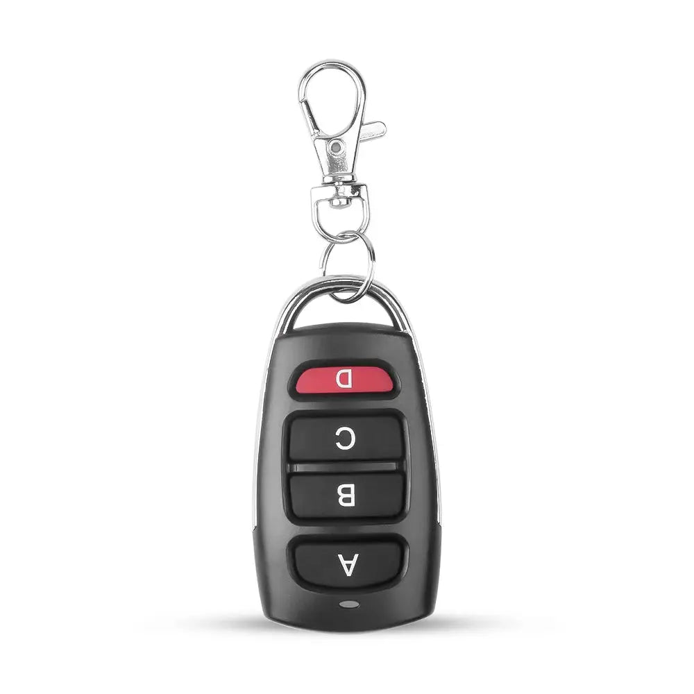 Wireless 433MHz garage door remote key fob with four black buttons and red top button on a metal key ring