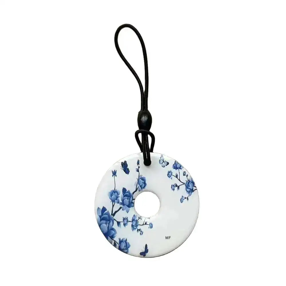 RFID key tag disk with blue floral pattern and black lanyard