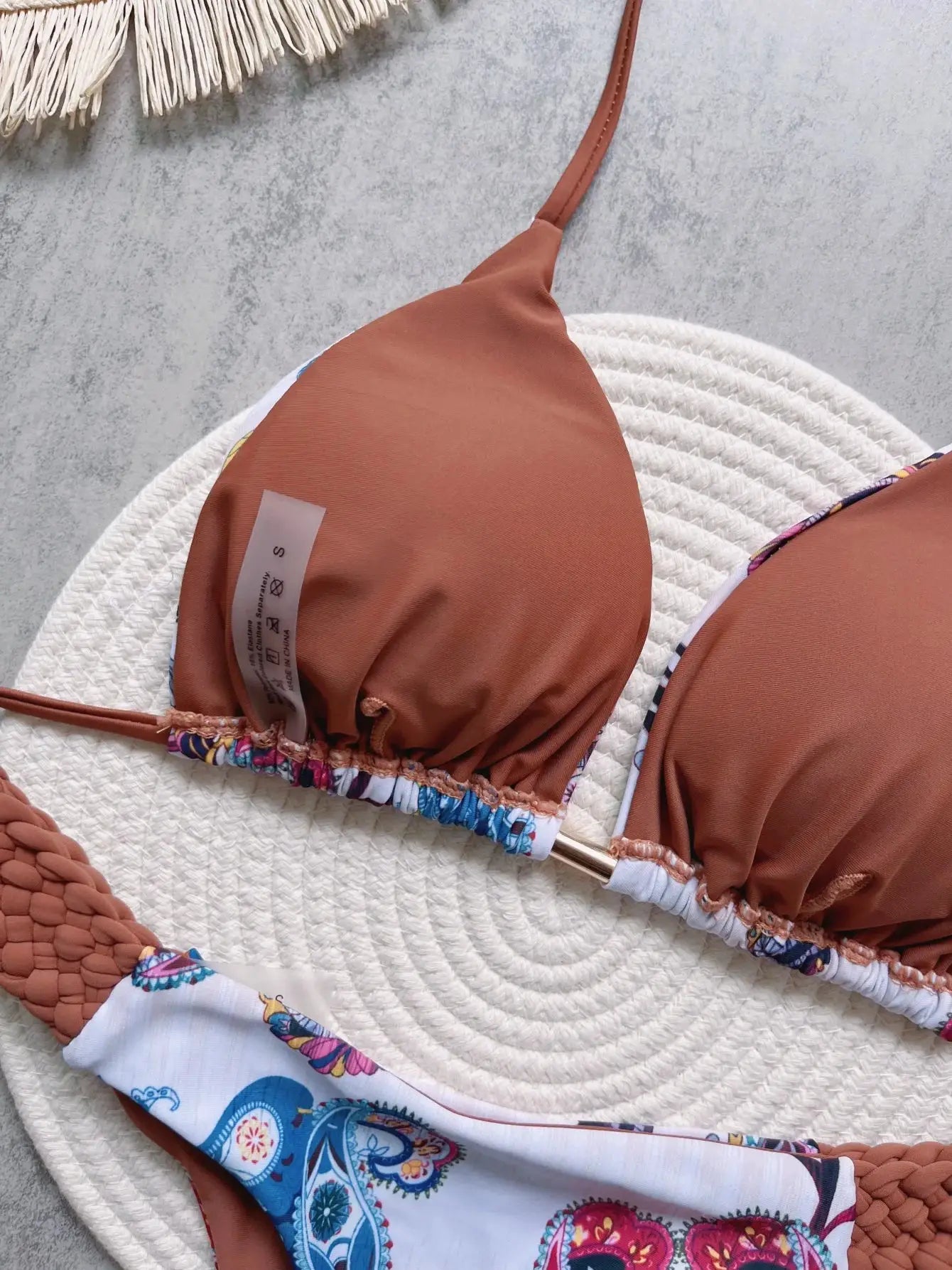 Simples Market RUOTONSEPT two-piece bikini set: orange-brown halter top and high-cut bottom with colorful trim.
