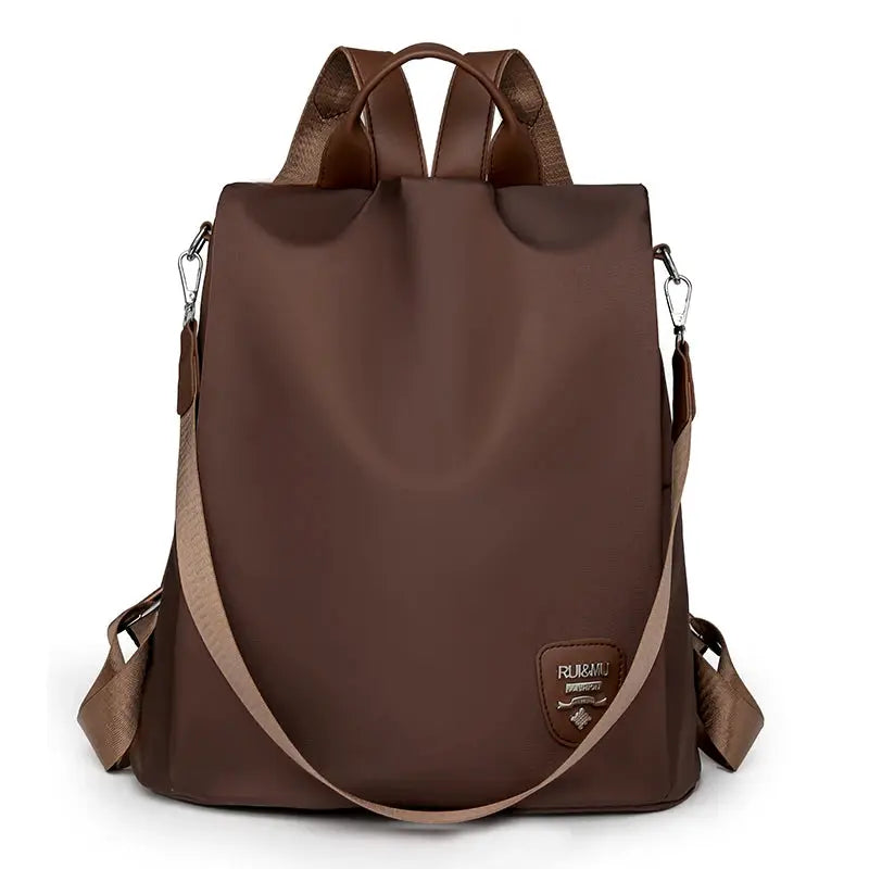 Women's brown anti-theft backpack by Simples Market with adjustable beige strap and large capacity