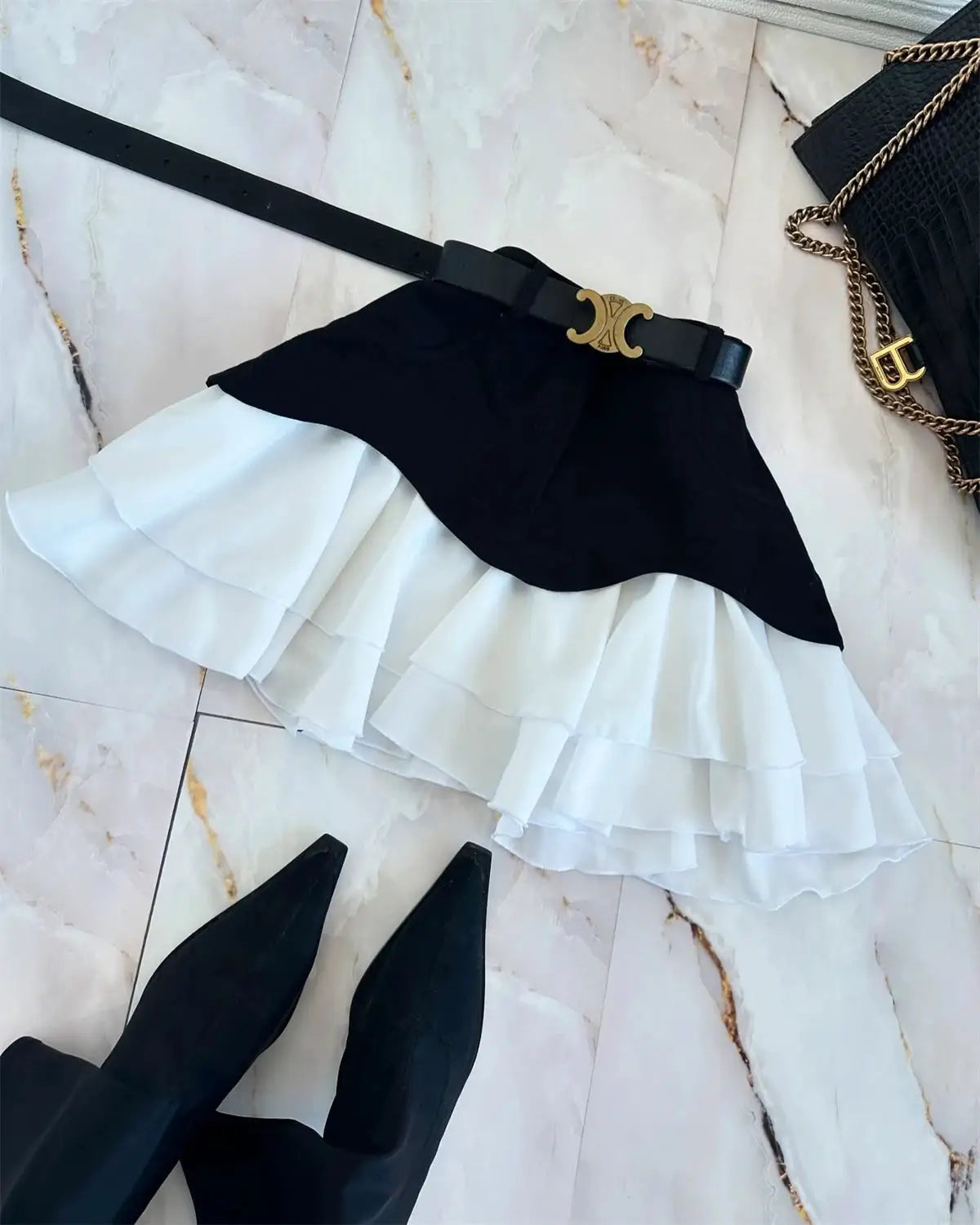 Women's high-waisted ruffle midi skirt with black overlay and white tiered underlayer, belt included