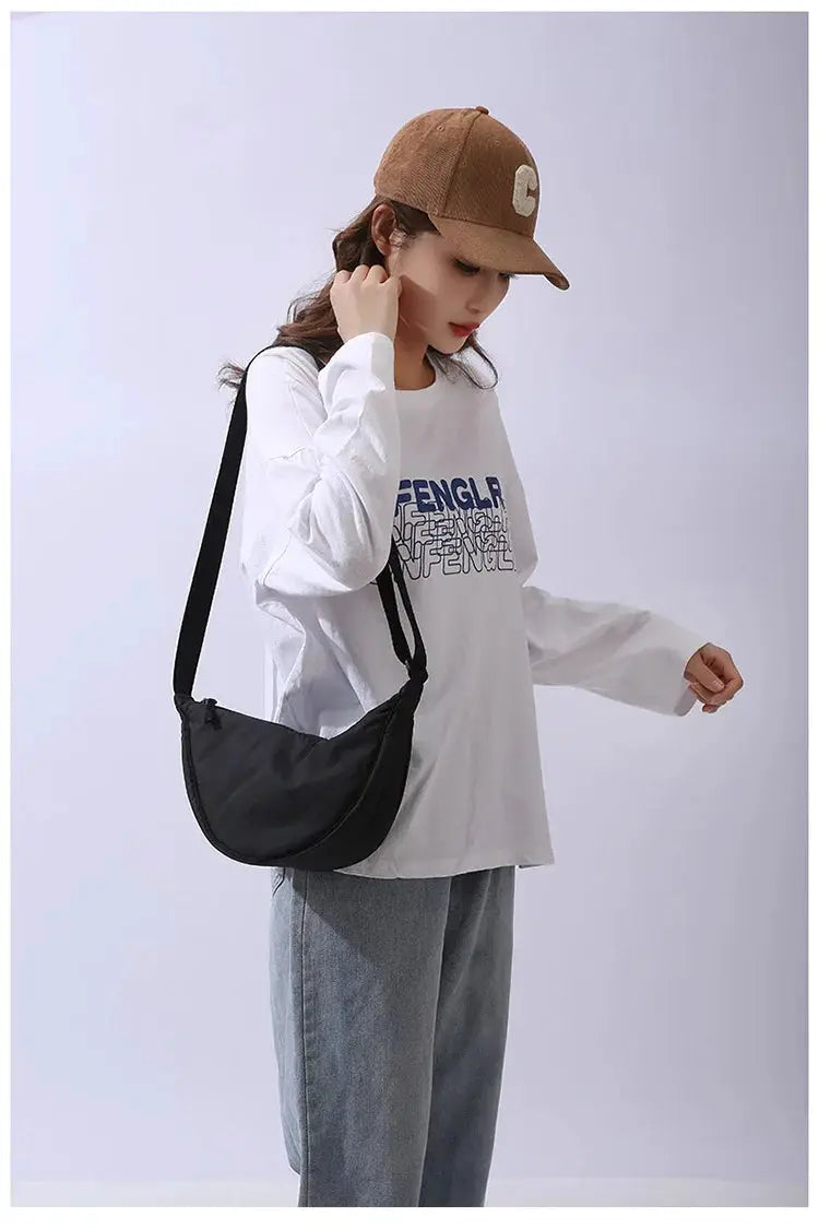 Crossbody bag for women in solid black nylon with padded design