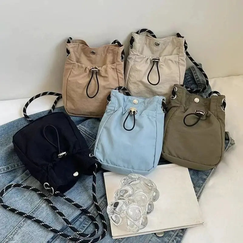 Nylon crossbody bags set in navy, beige, light blue, tan, and olive (5)