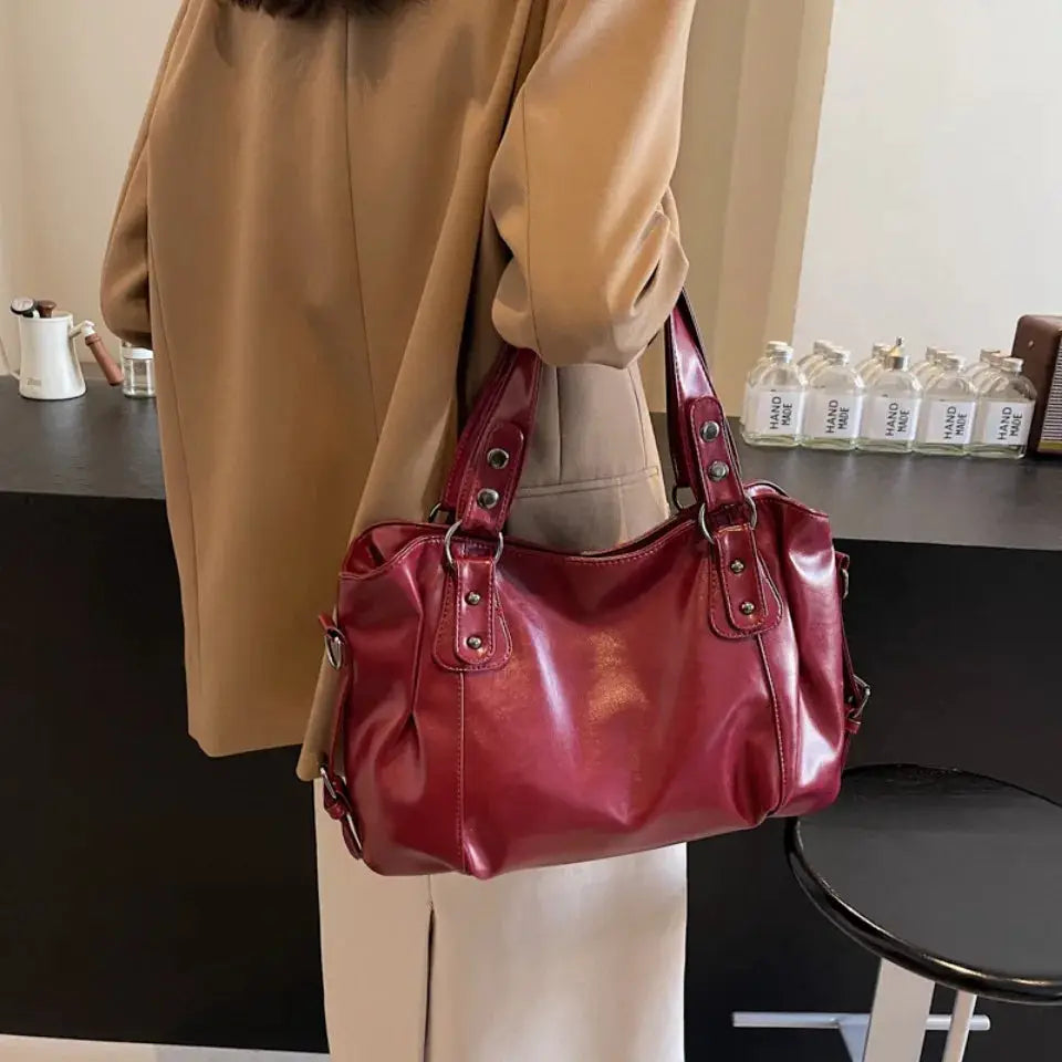Soft interior-compartment shoulder bag in burgundy PU leather with dual top handles
