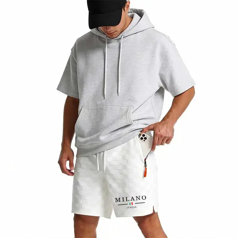 Two-piece men's gray hoodie and white checkered shorts set with Milano Italia logo and orange zipper pull