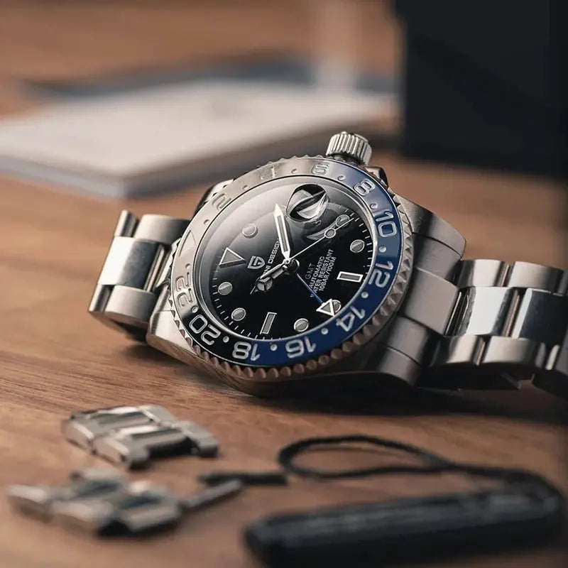 Pagani Design GMT watch for men; stainless steel bracelet, black dial with date cyclops, blue/black bezel