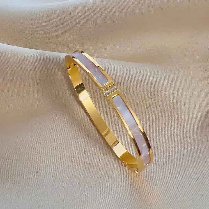 Gold-tone stainless steel women's cuff bracelets with white enamel inlays, openable bangles (set of 2)