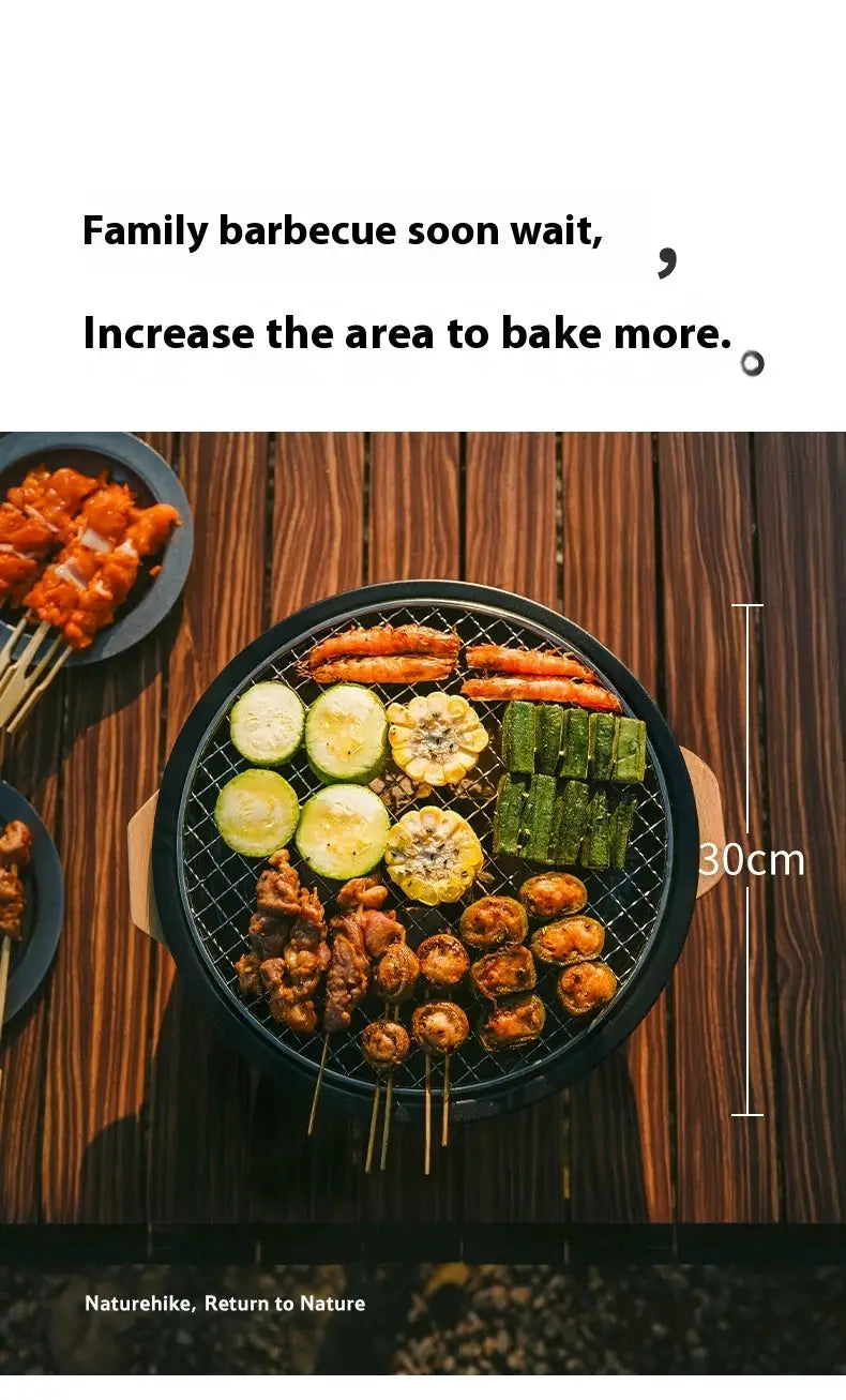 Naturehike outdoor tabletop barbecue stove, round black grill with meat skewers and vegetables.