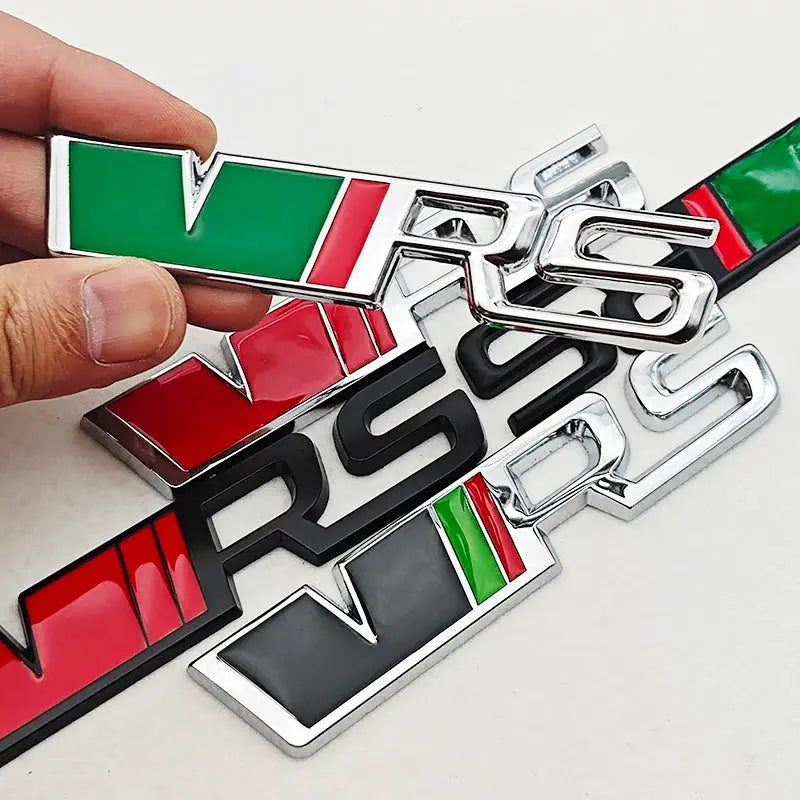 Set of several 3D metal VRS car emblems for Skoda, chrome finish with green/red enamel accents.