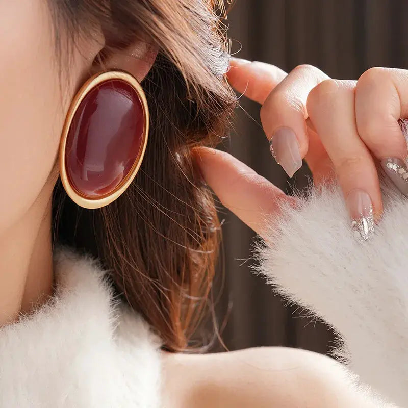 Vintage large red resin oval stud earrings with gold-tone bezel