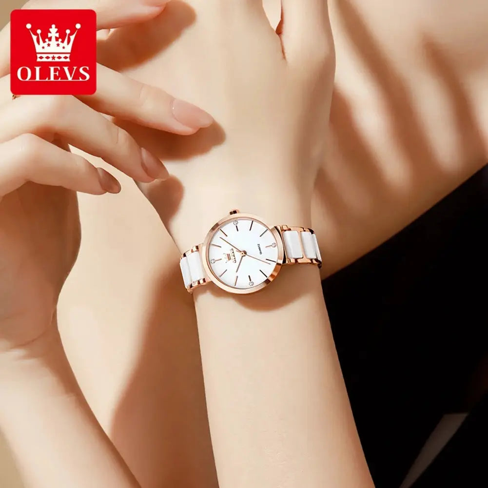 OLEVS women's watch with rose-gold case and white ceramic bracelet