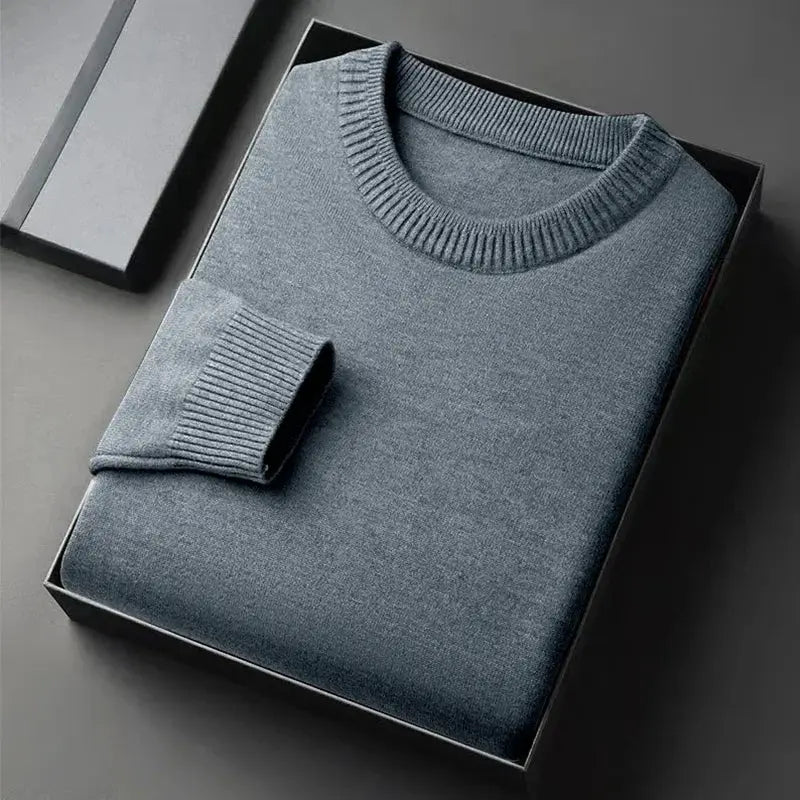 Men's slate-blue crewneck knit pullover sweater, soft lightweight fabric, folded in box