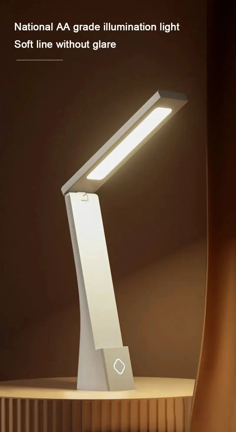 LED desk lamp in white with foldable arm and rectangular light bar; base features a diamond logo.
