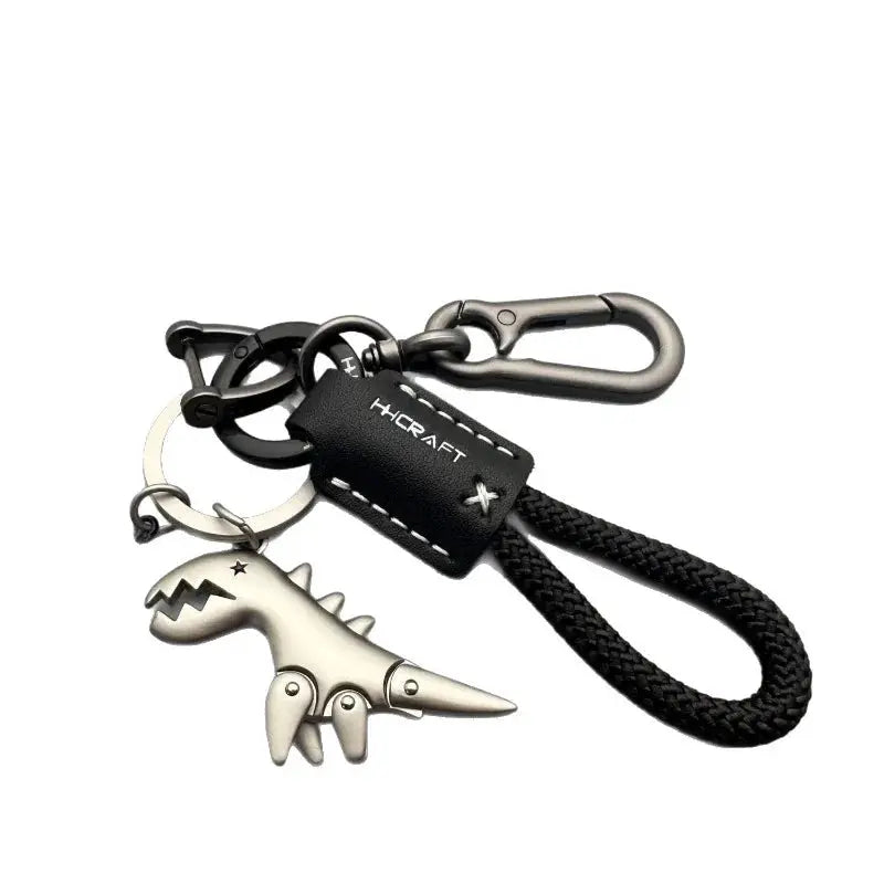 Simples Market motorcycle decoration keychain with black braided rope, silver dinosaur charm and leather tag