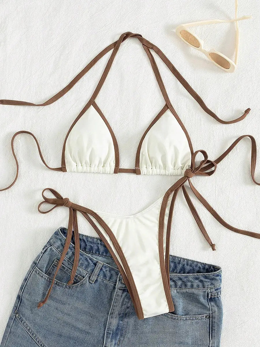 Simples Market two-piece bikini set in white with brown straps; triangle top and thong bottoms.