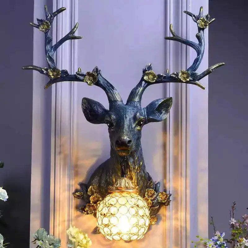 Lucky Deer Wall Lamp by Simples Market; blue resin deer head with gold floral accents and honeycomb glass bulb
