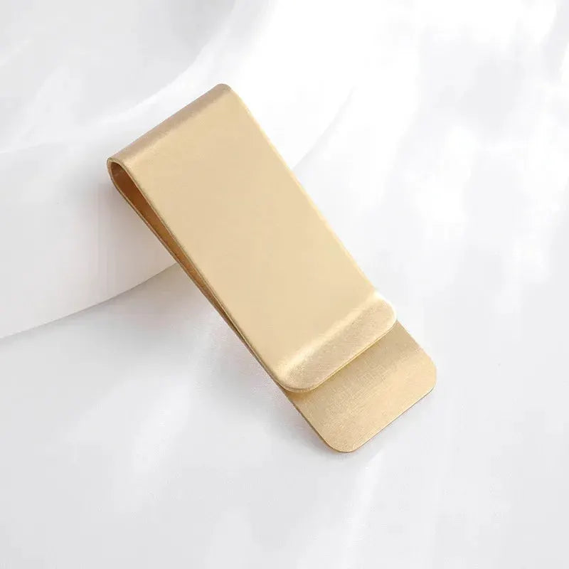 Gold stainless steel money clip with curved ends, compact belt clip for holding banknotes.