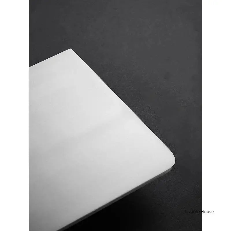 Corner bathroom shower shelf in white with rounded edge