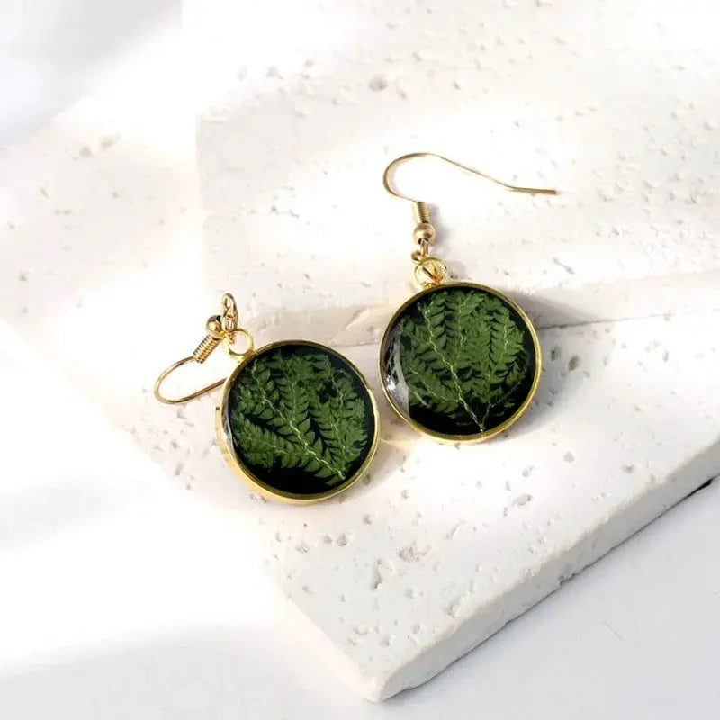 Simples Market pair of pressed green fern earrings with gold bezel and round epoxy resin drops