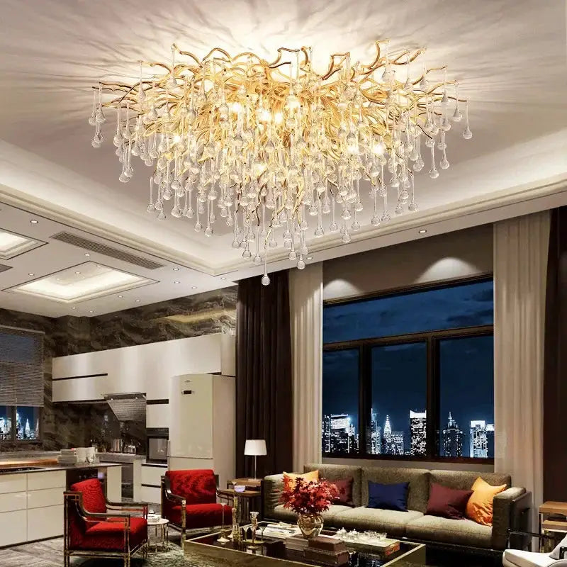 Royal Nordic luxury crystal chandelier with gold chrome water-drop pendants in a modern living room.