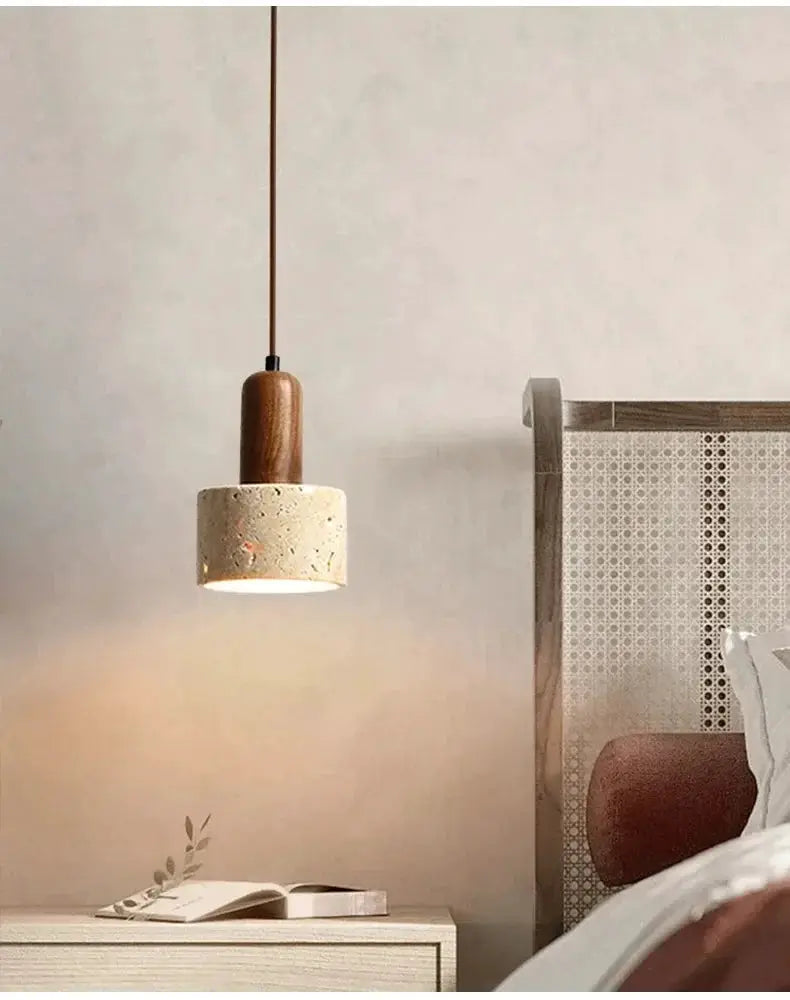 Simples Market travertine pendant light with wood cap over bedside table