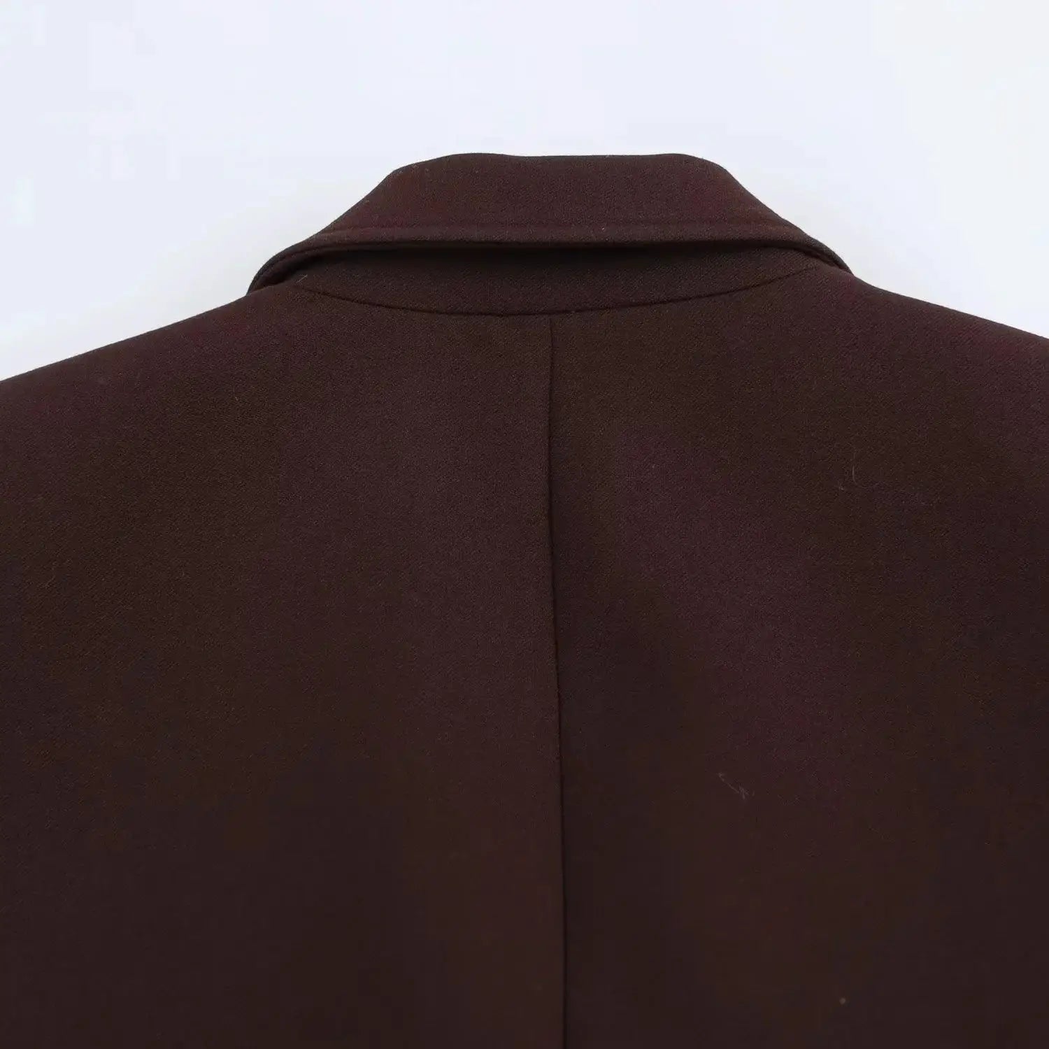 Women's brown blazer back view showing collar and center seam, tailored solid suit jacket