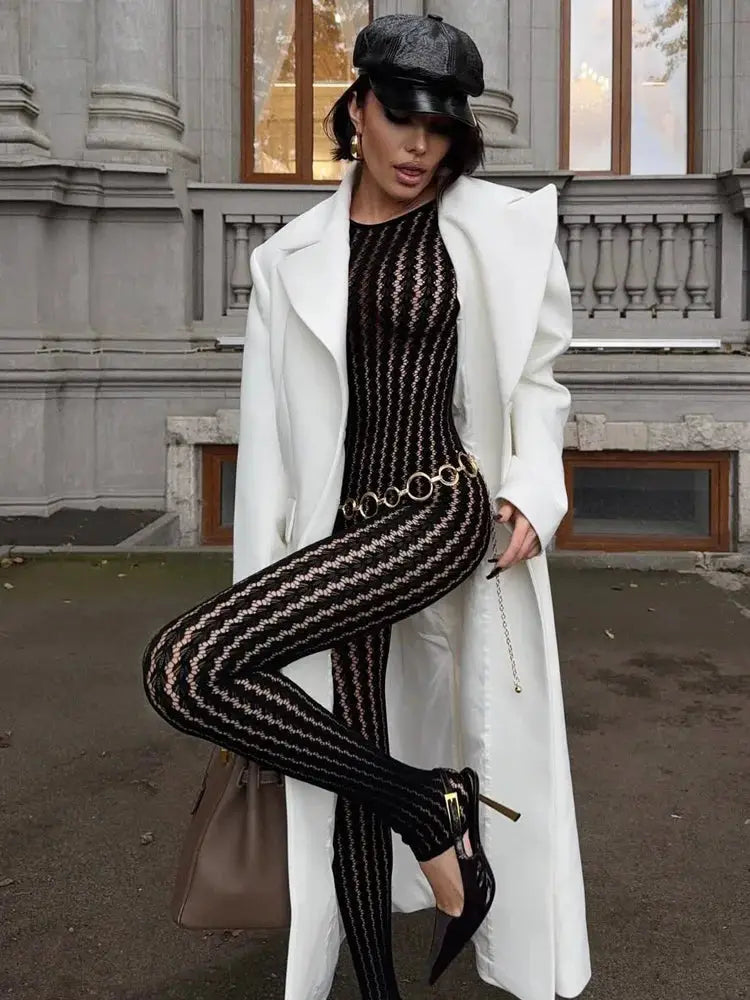 Tossy see-through black jumpsuit by Simples Market; wrap hollow-out patchwork printed, skinny fit.