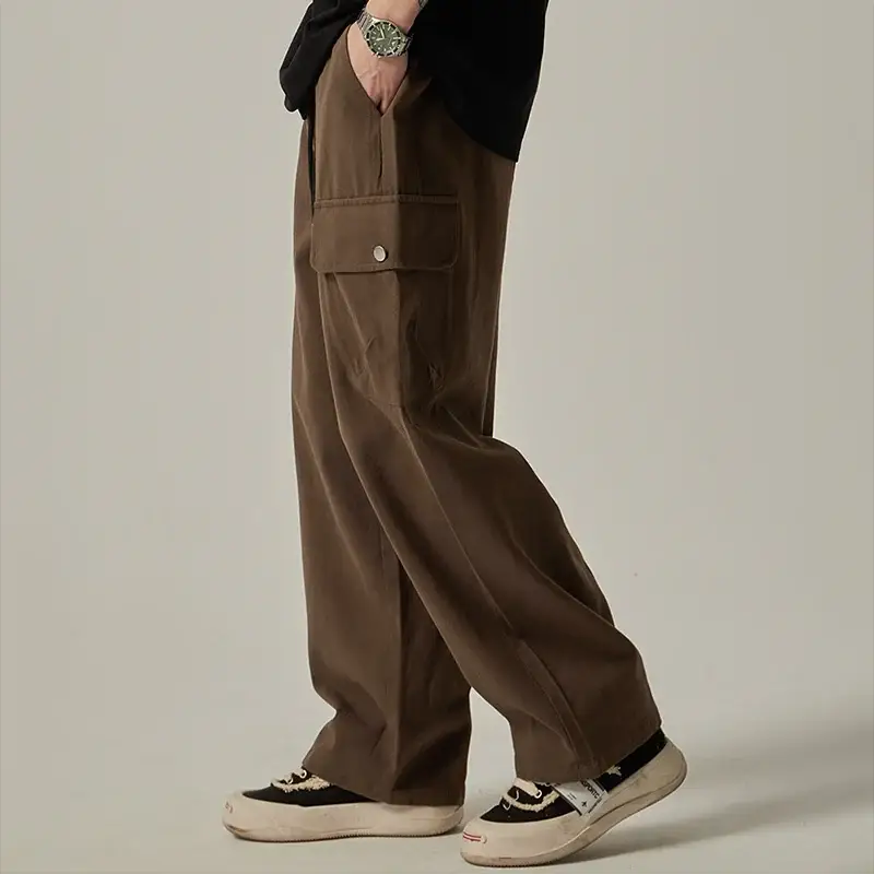 Men's brown cargo sweatpants with wide leg and large side flap pocket
