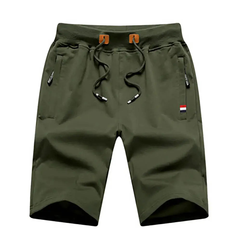 Olive green men's cargo jogger shorts with drawstring waist, zip pockets, and a small flag patch.