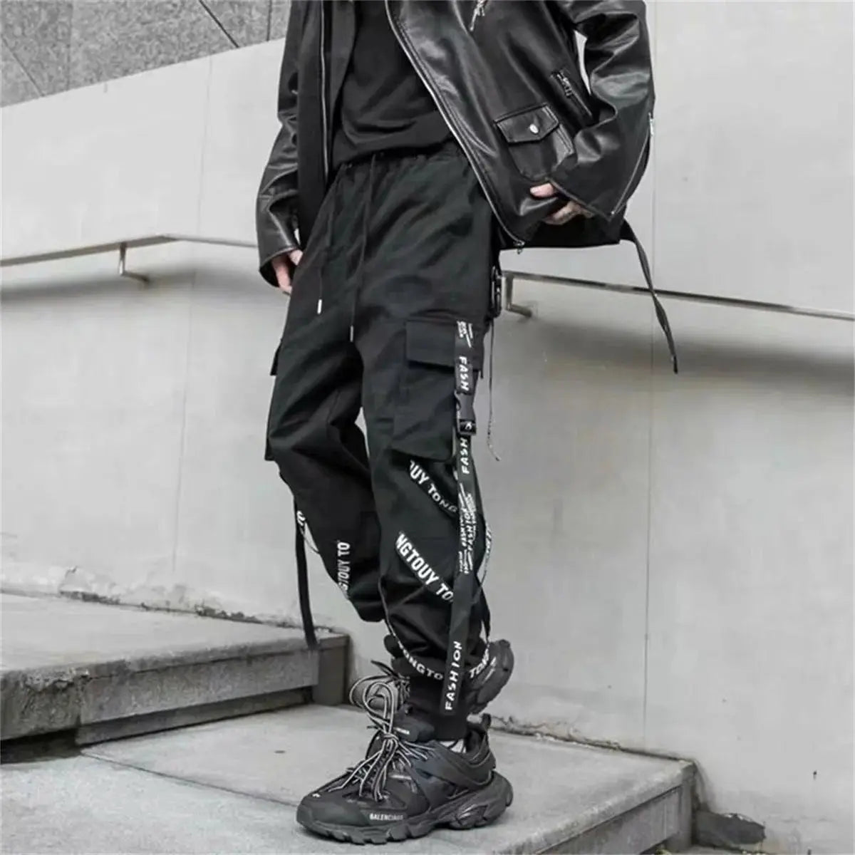 Men's black cargo pants with strap ribbon detailing and cargo pockets, Balenciaga sneakers