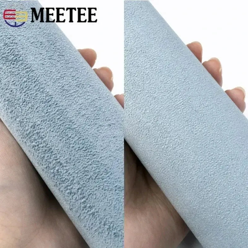 Self-adhesive suede fabric roll in light blue for car interiors, MEETEE branding visible