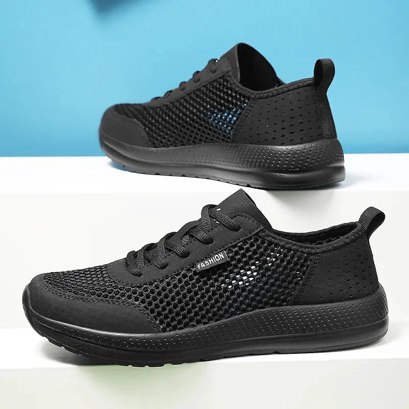 Pair of men's black breathable mesh running shoes with lace-up closure and lightweight design