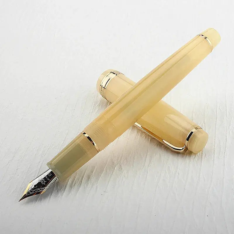 Jinhao 82 fountain pen in beige acrylic with gold trim; converter included