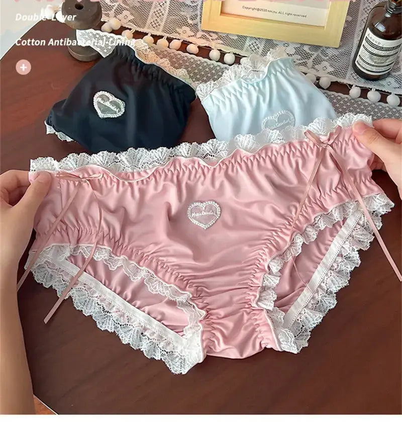 Panties set of three satin with white lace trim and heart embroidery in pink, black, and light blue by Simples Market
