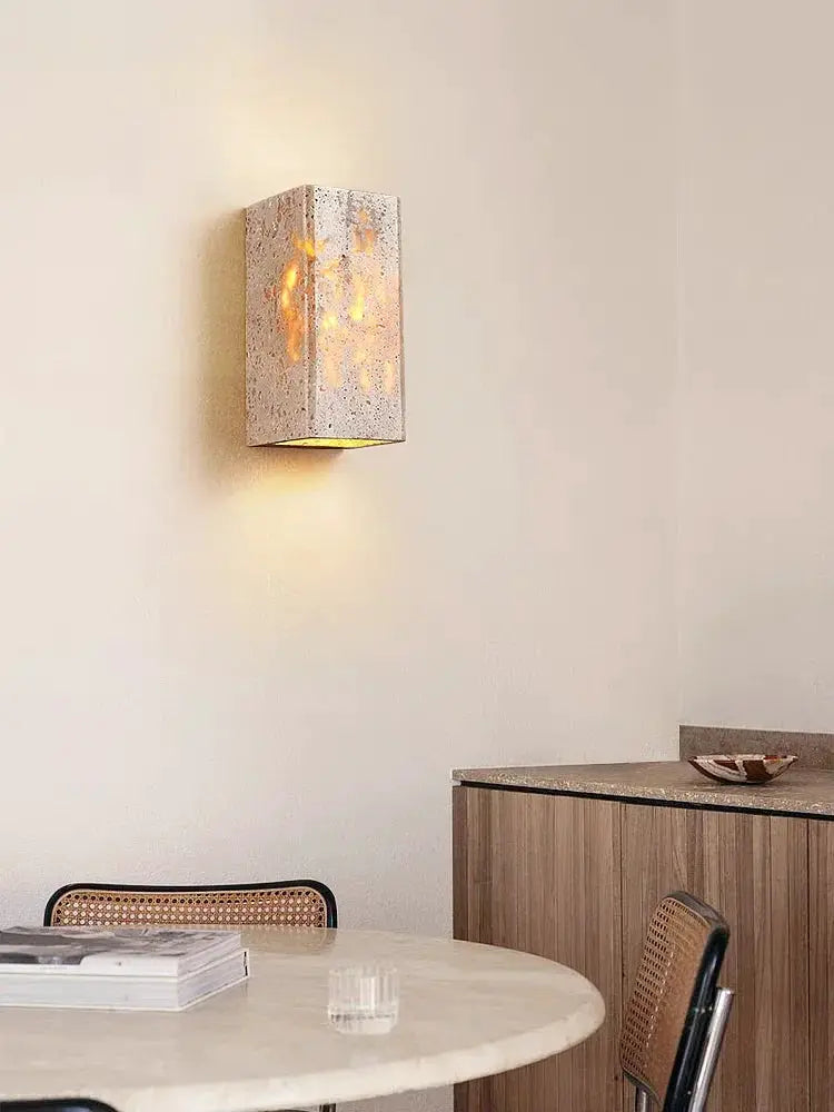 Wabi Sabi yellow marble wall lamp in travertine finish with warm LED glow