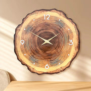 Wooden ring-veneer wall clock with natural wood grain, white numerals and dots, gold hands, silent movement