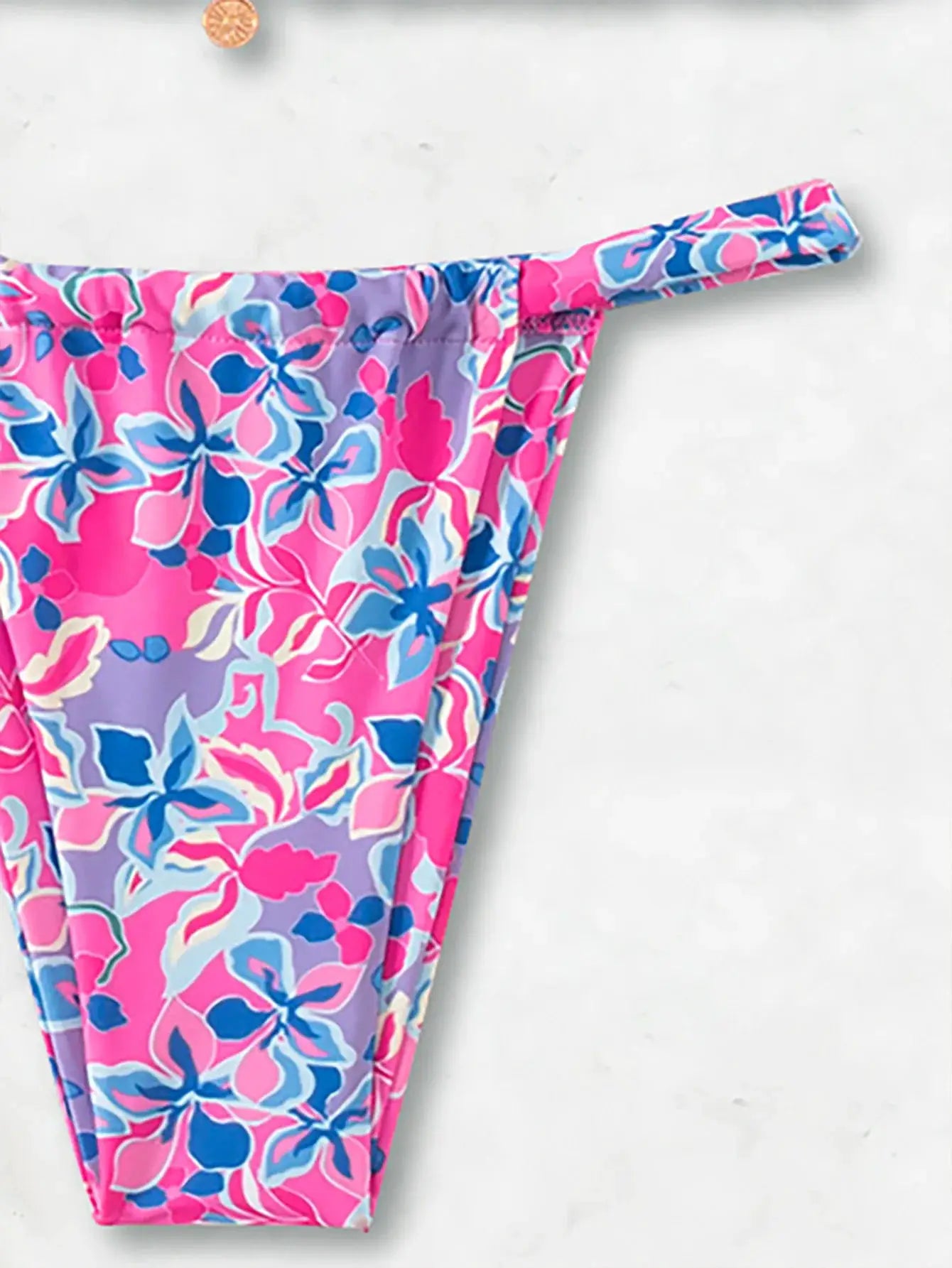 Triangle bikini bottom in pink floral print with blue accents by Simples Market