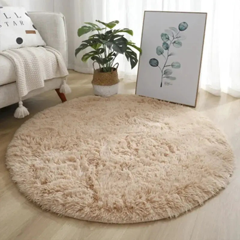 Round plush rug, beige fluffy thick pile for living room or bedroom decor.