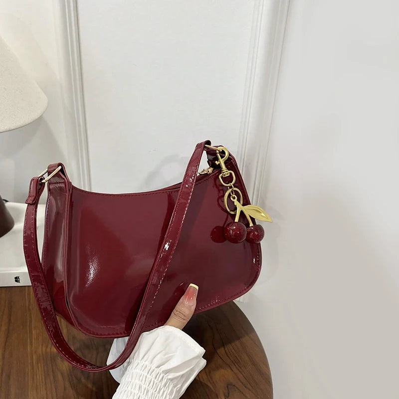 Women's PU leather handbag in cherry red with a gold cherry pendant charm, Simples Market shoulder bag