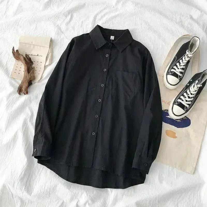 Oversized black long-sleeve shirt with chest pocket and turn-down collar from Simples Market