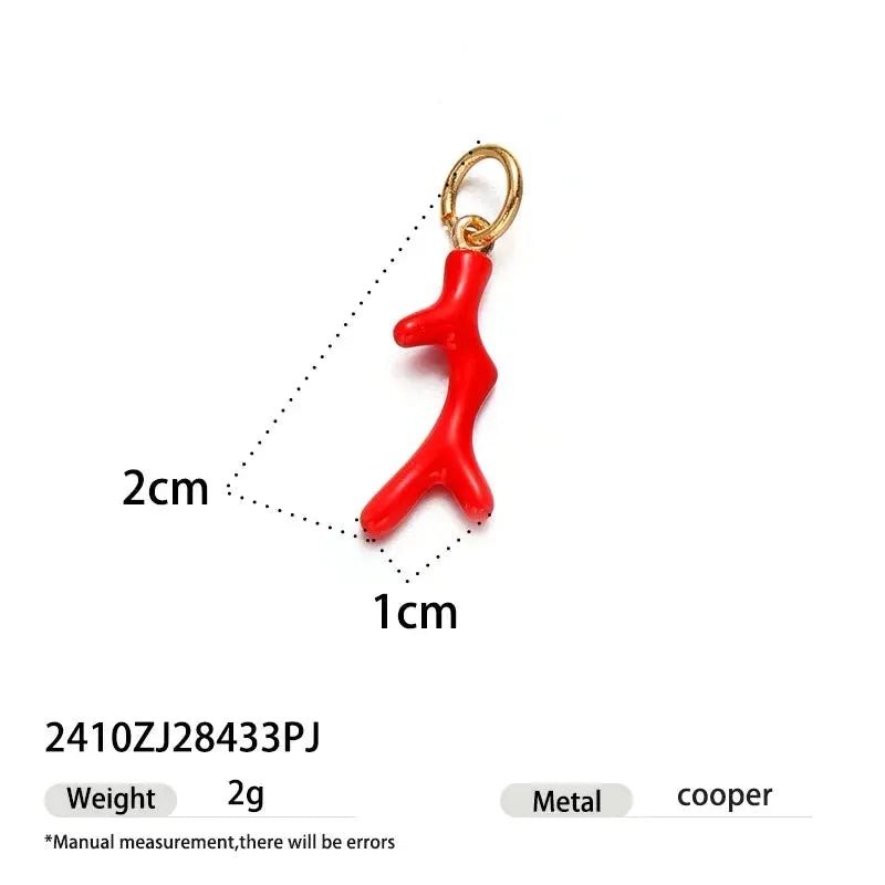 Red dinosaur-shaped pendant on a gold-tone single hoop earring