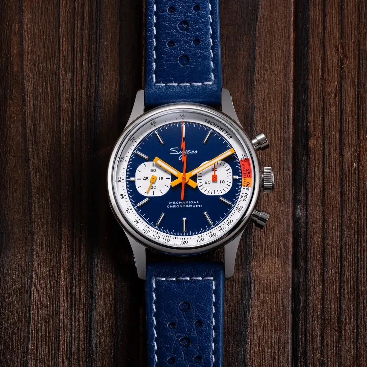 Sugess men's chronograph watch with blue dial, orange hands, white subdials, tachymeter bezel, blue leather strap.