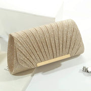 Simples Market sequined clutch bag with champagne-gold shimmer and gold bar accent